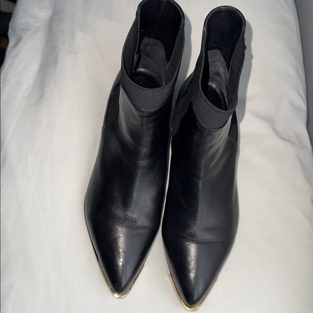 Sofia Baldi Suola Black Leather Ankle Boots with Gold Accents toe.